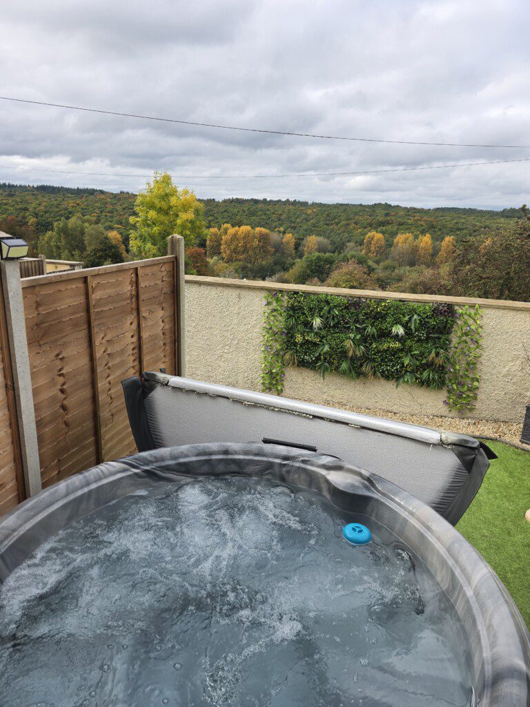 hot tub with forest views at Wyldwood Cottage
