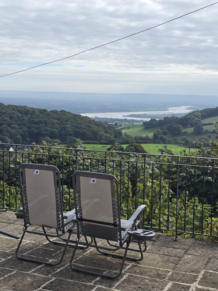Sun loungers looking out upon river and countryside views