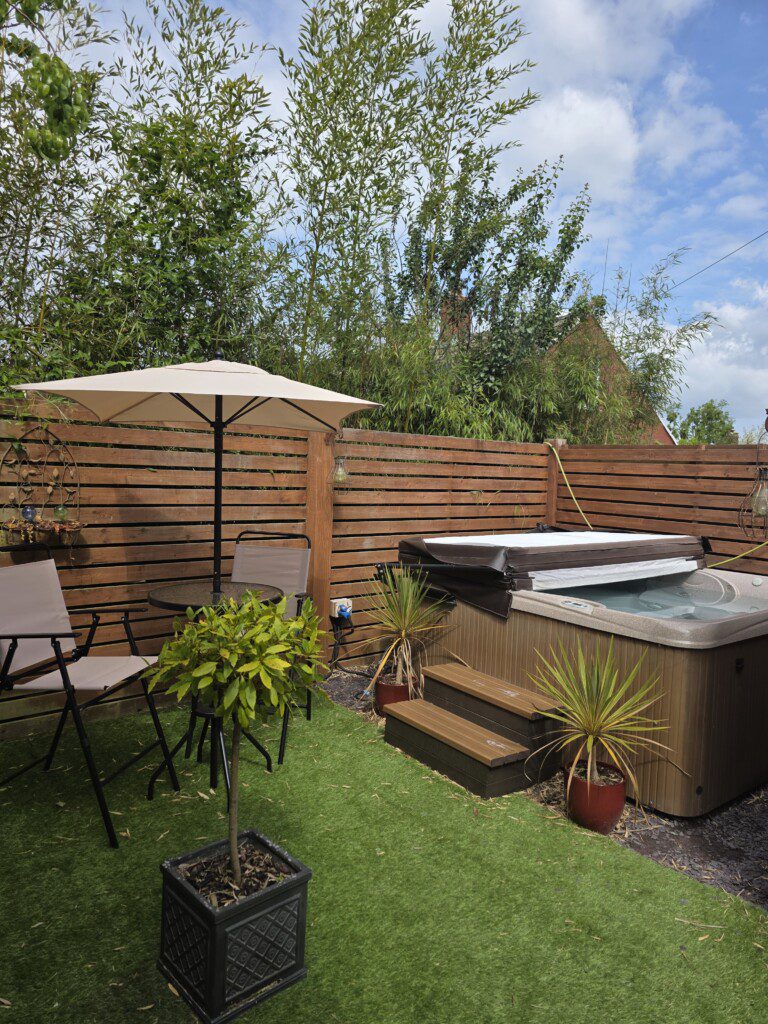 Courtyard garden with seating and hot tub