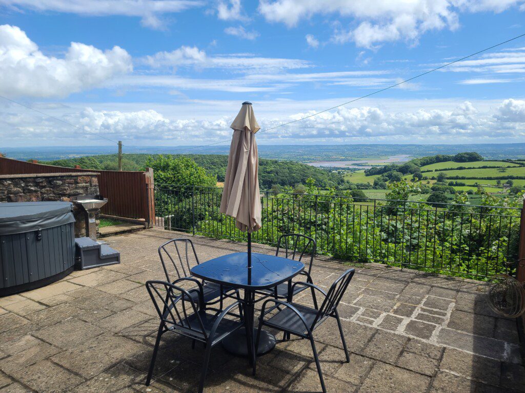 Seating and panoramic views from Woodland barn