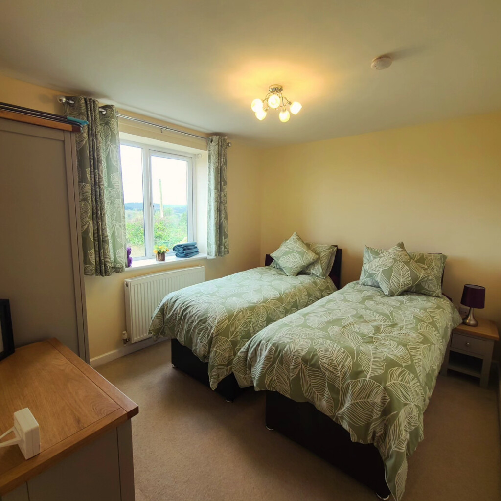 Twin bedroom at Wyldwood Cottage