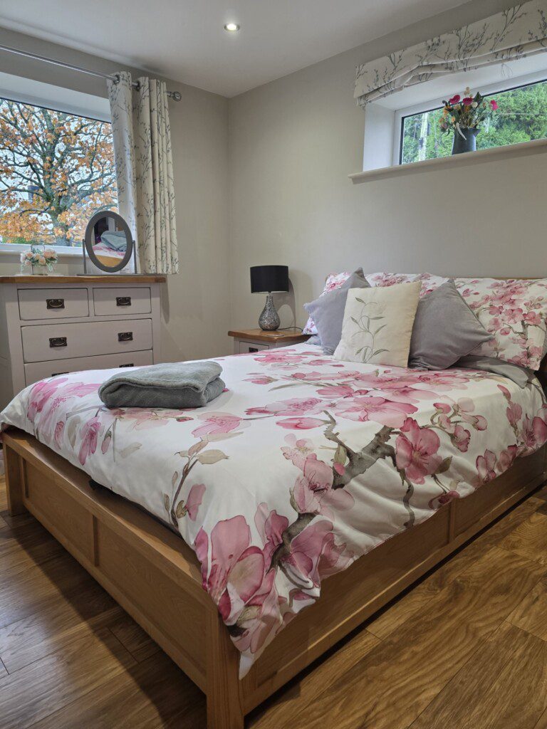 Cosy bedroom with floral bedding.